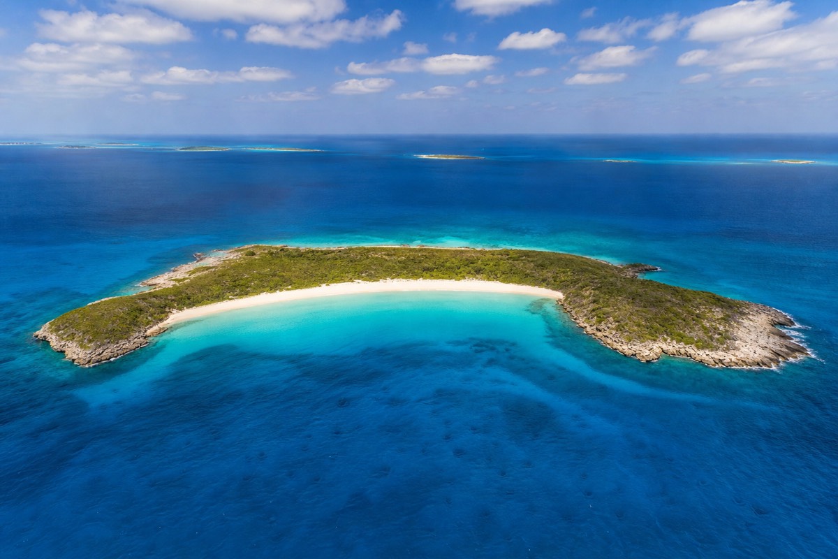 The remote beach at Big Major Cay in the Exuma cays where the original swimming pigs live