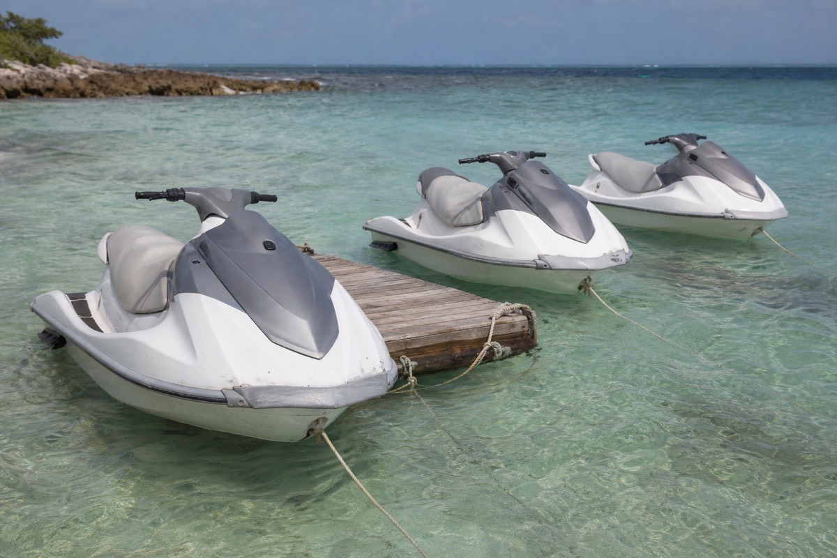 Rental watercraft moored off a Nassau beach